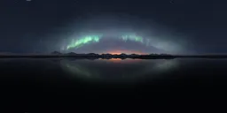 Starry sky over reflective lake with Northern Lights and mountaintops at dusk for HDR lighting.