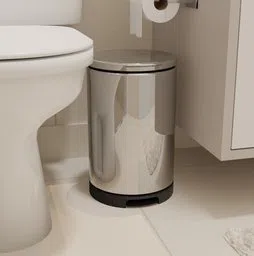 Realistic 3D-rendered metal trash can with pedal next to a toilet, optimized for Blender use.