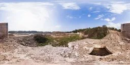 360-degree HDR panorama of a desolate landscape with broken concrete under a dynamic sky with sun and clouds.