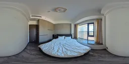 360-degree panoramic HDR image of an elegant bedroom with natural lighting and balcony view.