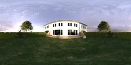 12K panoramic HDR image of a summer garden with house, green lawn, trimmed hedges, and purple flowers.