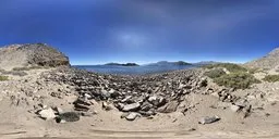 360-degree HDR panorama featuring a rocky beachfront with clear skies for realistic lighting in 3D scenes.