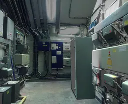 High-resolution image of a dimly lit technical control room with electrical panels and piping, suitable for scene lighting.