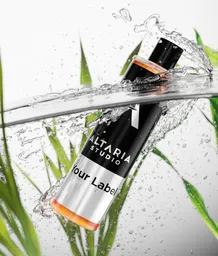 Dynamic 3D cosmetic bottle mockup with splashing water effect, ideal for product visualization in Blender.