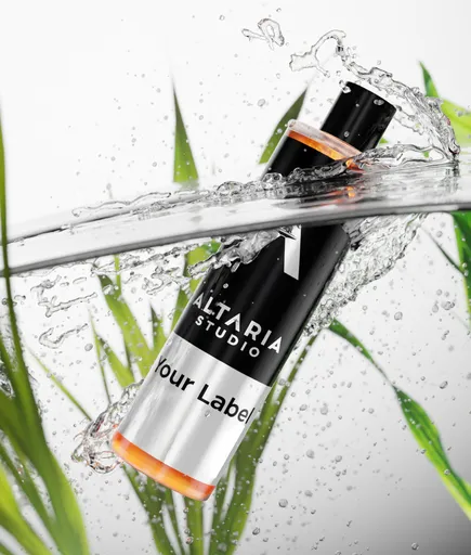 Dynamic 3D cosmetic bottle mockup with splashing water effect, ideal for product visualization in Blender.