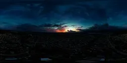 Vivid aerial cityscape during sunset with dramatic clouds suitable for scene lighting.