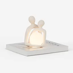 Couple sculpture with book