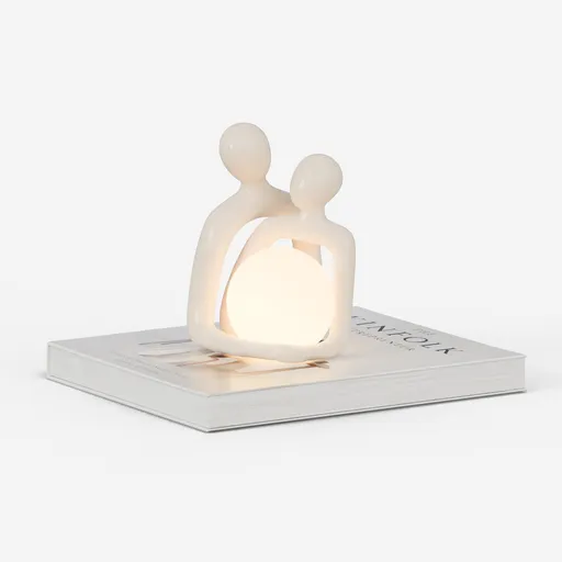 Couple sculpture with book