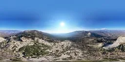 360-degree panoramic mountain HDR for realistic lighting in 3D scenes, featuring clear skies and rugged terrain.