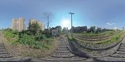 360-degree HDR image showing railway lines with clear blue sky, perfect for lighting 3D urban scenes, 8K resolution.