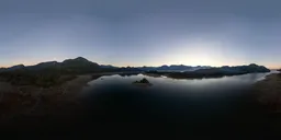 High-resolution aerial HDR panorama of a tranquil lake during twilight with clear sky gradient reflections for scene lighting.