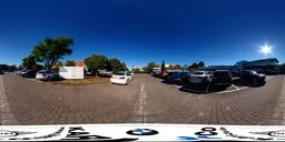 360-degree HDR image of a sunny car park with clear blue sky, ideal for realistic lighting in 3D scenes.