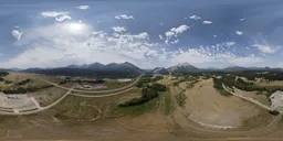 360-degree HDR panorama of mountains, roads, and fields for realistic lighting in 3D scenes.