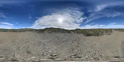 360-degree high-resolution HDR image featuring blue sky with clouds, rocky terrain, and sparse trees for realistic lighting in 3D scenes.