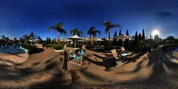 360-degree HDRI of a poolside with sun loungers and palm trees, ideal lighting for 3D rendering.