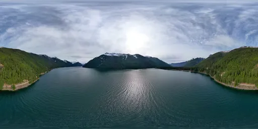 360 HDRi of serene lake with mountain reflections under a clear sky, perfect for realistic lighting in CGI scenes.