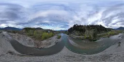 360-degree HDR panorama showcasing a river winding through mountainous terrain under a moody overcast sky.