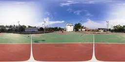 Bright outdoor basketball court HDR with clear blue sky and fluffy clouds for realistic scene lighting.