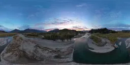 Aerial Sunset over River and Mountains