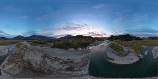 Aerial Sunset over River and Mountains