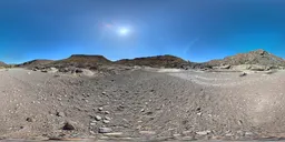 360-degree HDR panoramic view of a mountainous rocky terrain with clear blue sky for scene lighting.