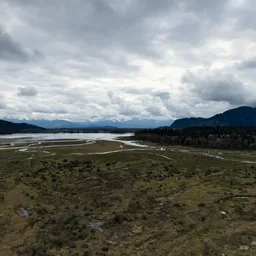 Overcast Sky River and Mountains