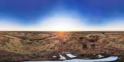 Sunrise over expansive plains with clear HDR lighting for scene illumination.