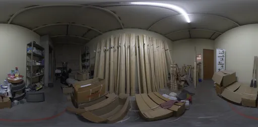 Dimly lit interior HDR panorama of a cluttered timber storage space with wooden planks and construction materials.