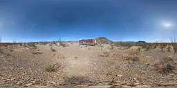 Equirectangular 16k HDR image featuring desert landscape with clear blue sky for realistic lighting in 3D scenes.