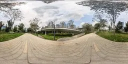 360-degree HDRI panorama of a footbridge with surrounding greenery and overcast sky for realistic scene lighting.