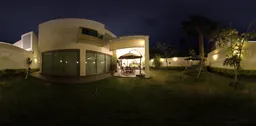 360-degree HDR panorama of a well-lit garden and patio area at dusk for realistic lighting in 3D scenes.
