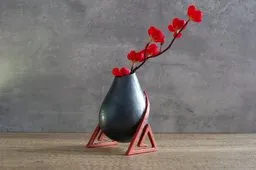 Footed bulb shaped vase