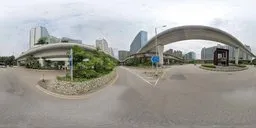 360-degree panoramic HDR featuring a city viaduct with overpasses, lush greenery, and urban buildings, for realistic lighting in 3D scenes.