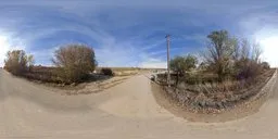 360-degree HDR image featuring a serene country road with clear blue sky, ideal for realistic scene lighting.