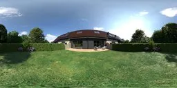 360-degree panoramic HDR of a serene garden with a house, green lawn, trimmed hedges, and purple flowers for scene lighting.