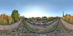 Detailed HDR image capturing the essence of dusk with serene blue skies over an old urban train station setting.