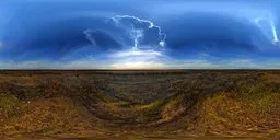 360-degree HDR panorama of a grassy field under a dramatic cloud-filled sky for scene lighting.