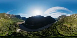 Aerial HDR panorama of sunlit mountains, lush greenery, and winding river for scene lighting.