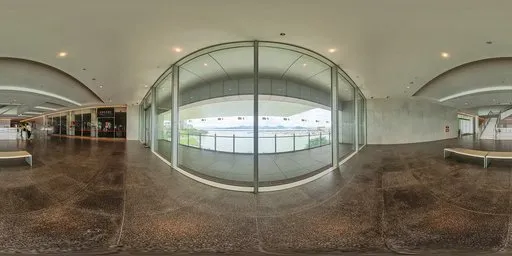 Panoramic HDR image of an empty, carpeted indoor observation area with expansive windows under daylight.