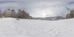 Snow-covered landscape HDR panorama with cloudy skies for 3D scene lighting