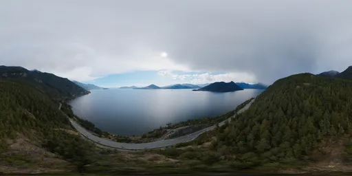 Aerial HDR panorama of a serene Canadian coastal mountain range with cloudy skies for realistic scene lighting.
