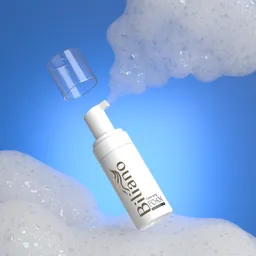 Detailed 3D model of a foaming facewash dispenser with lather, positioned against a blue background.