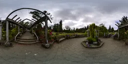 360-degree HDR image showing a serene garden pathway surrounded by lush flowers for scene lighting.