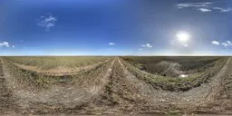 Dirt road texture and horizon under a clear blue sky for realistic HDR lighting in 3D scenes.