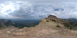 360-degree HDR panorama with overcast mountain scenery for realistic lighting in 3D renders.