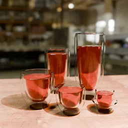 Realistic Blender 3D render of a set of double-walled glasses on a wooden surface.