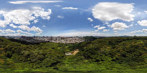 Cloudy skies over mountains and forests