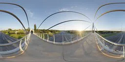360-degree HDR image of a sunlit pedestrian overpass with clear sky for scene lighting.