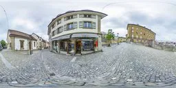 360-degree HDR image of cobblestone paved street with diverse architecture under overcast sky for scene lighting.