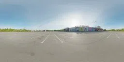 360-degree HDR image of an empty mall parking lot with clear skies for realistic lighting in 3D scenes.